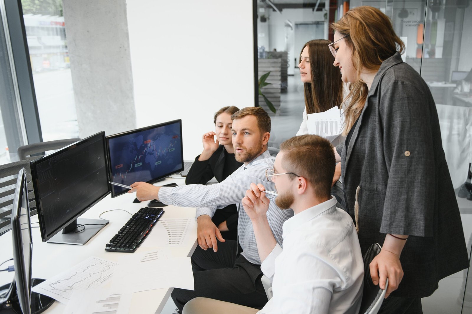 Group of businessmen and businesswomen stock brokers working at office